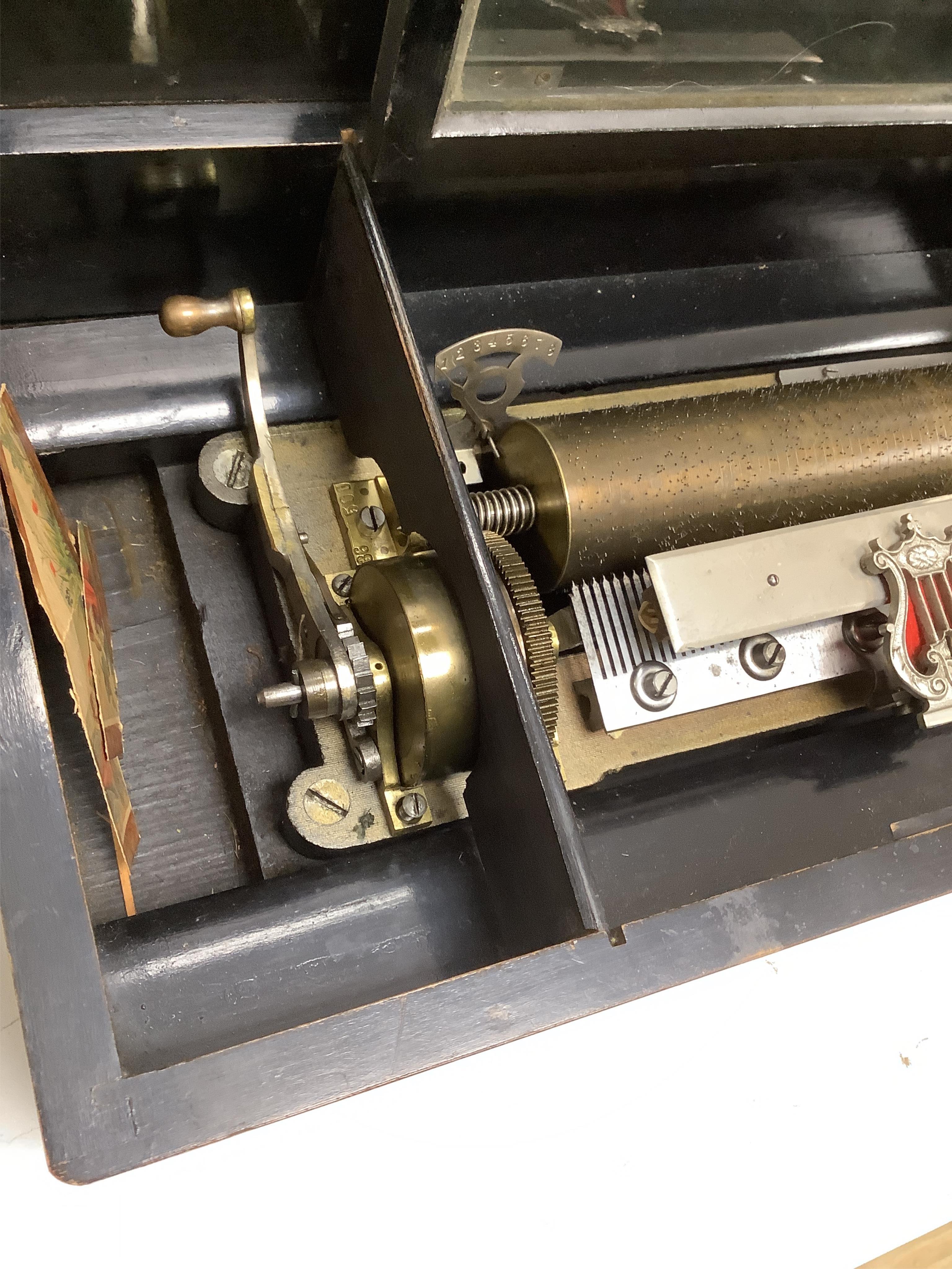A late 19th century Swiss cylinder music box, 56cm wide.